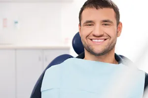Young man smiling in dental chair