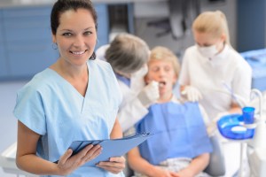 Smiling female dental assistant