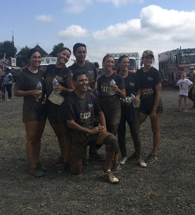A photo of the Emmi Dental team after running the 2017 Mud Run.
