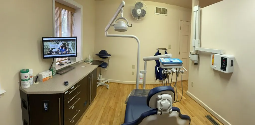 view of a computer from behind the dental chair