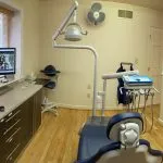 view of a computer from behind the dental chair