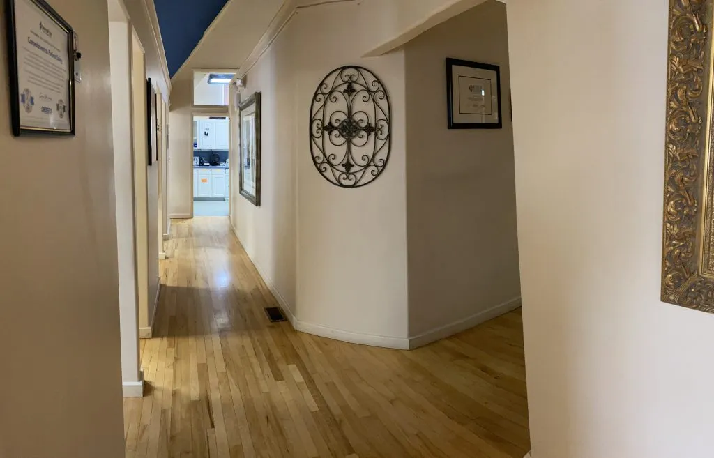 hallway with art and framed accolades