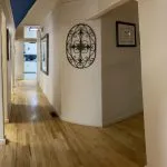 hallway with art and framed accolades